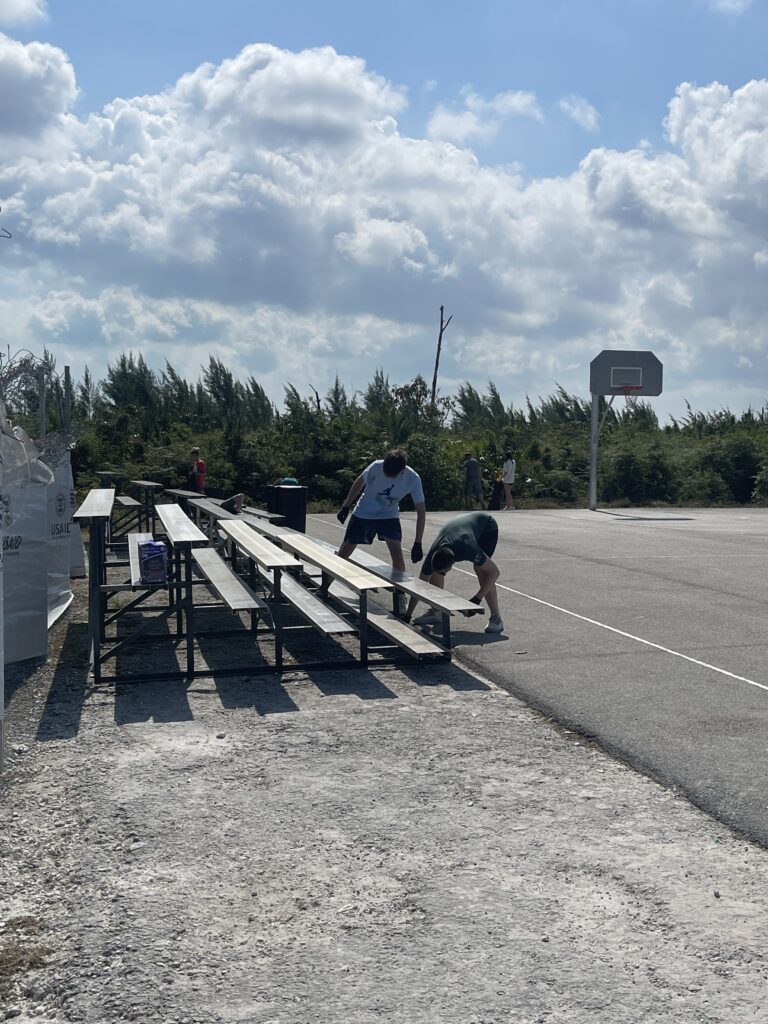 Team members picking up at the outdoor basketball court