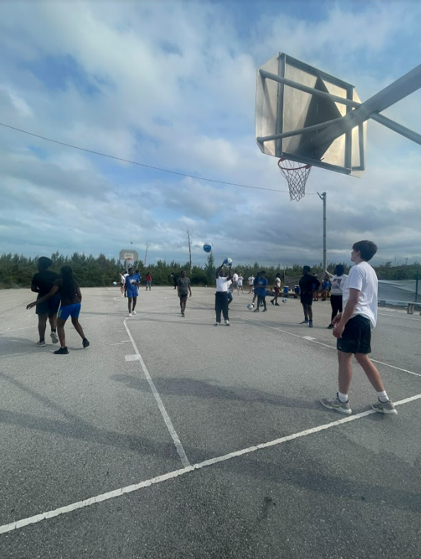 Basketball camp participants practicing their skills.