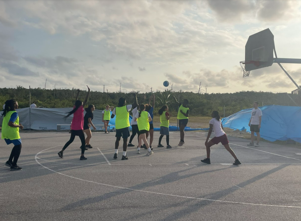 A sunset scrimmage during the girls basketball camp.