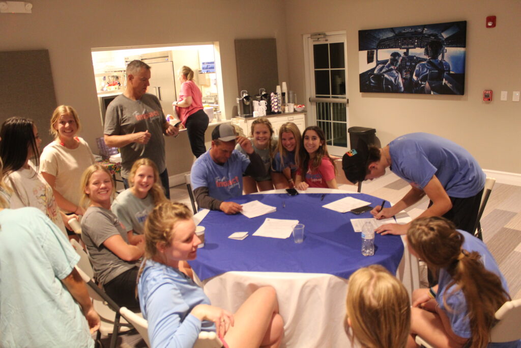 The Impact group hanging out in the main area at Missionary Flights International.