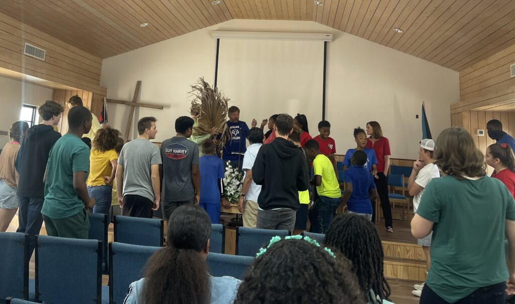 Team and students at a local school chapel planning for their field day.