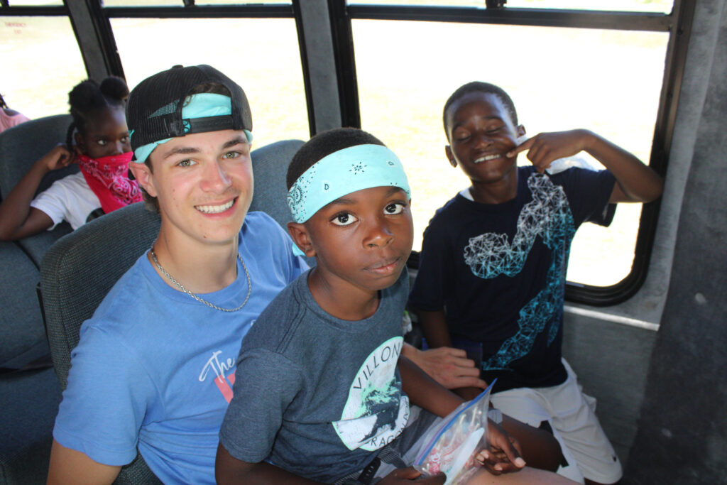 Students riding the school bus home after camp